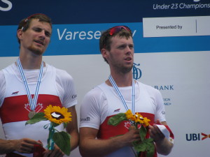 Grayson Gray of Thorold, left, and James Myers of Beamsville on the podium in Italy as they received their bronze medals at the U23 World Rowing Championship in July.