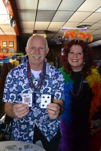 Bowling a strike or spare earned team members playing cards: best poker hand earned a prize. Grimsby alderman Dave Kadwell celebrates the first strike of the morning. With him is Renee Rebelo, Grimsby DIA chair